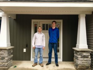 Sable Homes construction superintendent Sean Moody and Jordan Duchon, 17, of Ada stand in front of a house under construction in the Sable Valley subdivision in Ada. Duchon is a student at West Michigan Aviation Academy student who observed the construction process as a Sable Homes job shadow participant on Nov. 28, 2016. 